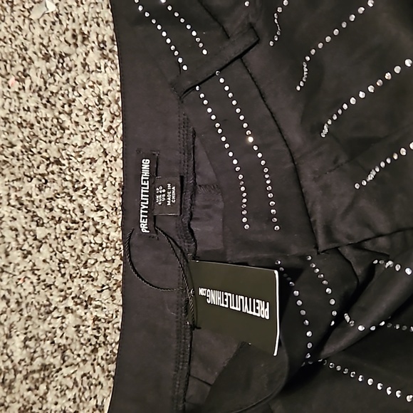 size 12. Black pants. Great for going out. New with tag. Pretty little thing - Picture 1 of 10